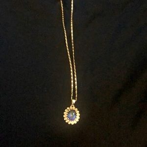 Gold plated costume necklace. 18” long chain with blue stone pendant